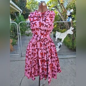 Sarsparilly Pink Dress with Red Bow Design